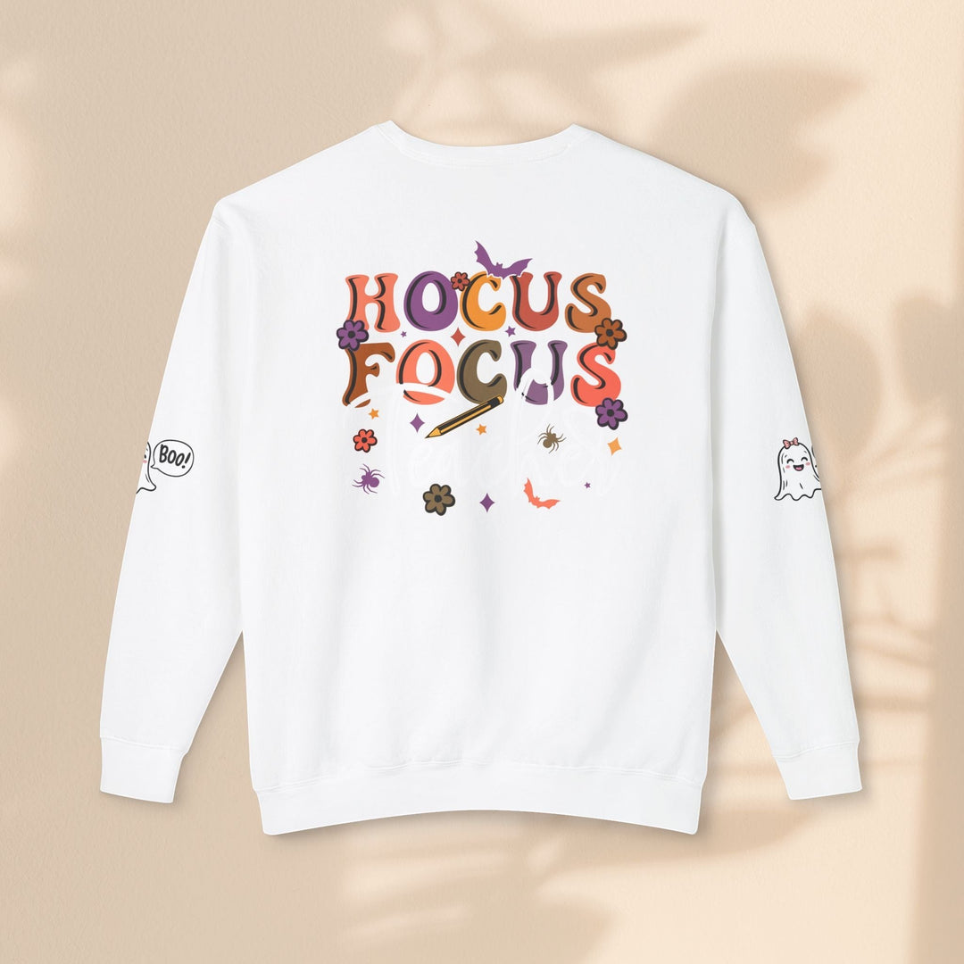 Sea Dragon Dreams white crewneck sweatshirt with Hocus Focus Teacher graphic, ghost, and spider designs on sleeves.