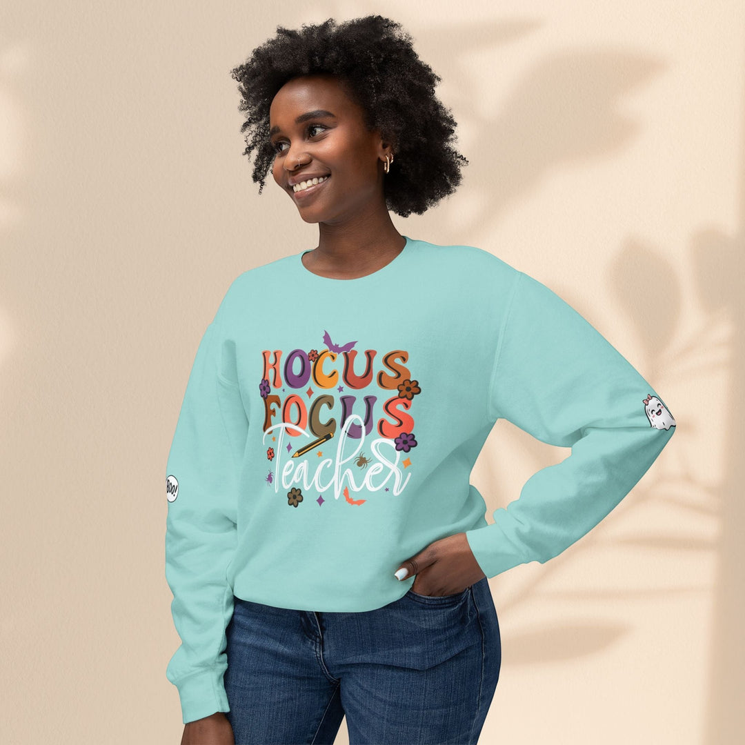Sea Dragon Dreams light blue crewneck sweatshirt with Hocus Focus Teacher graphic and ghost sleeve detail on a model