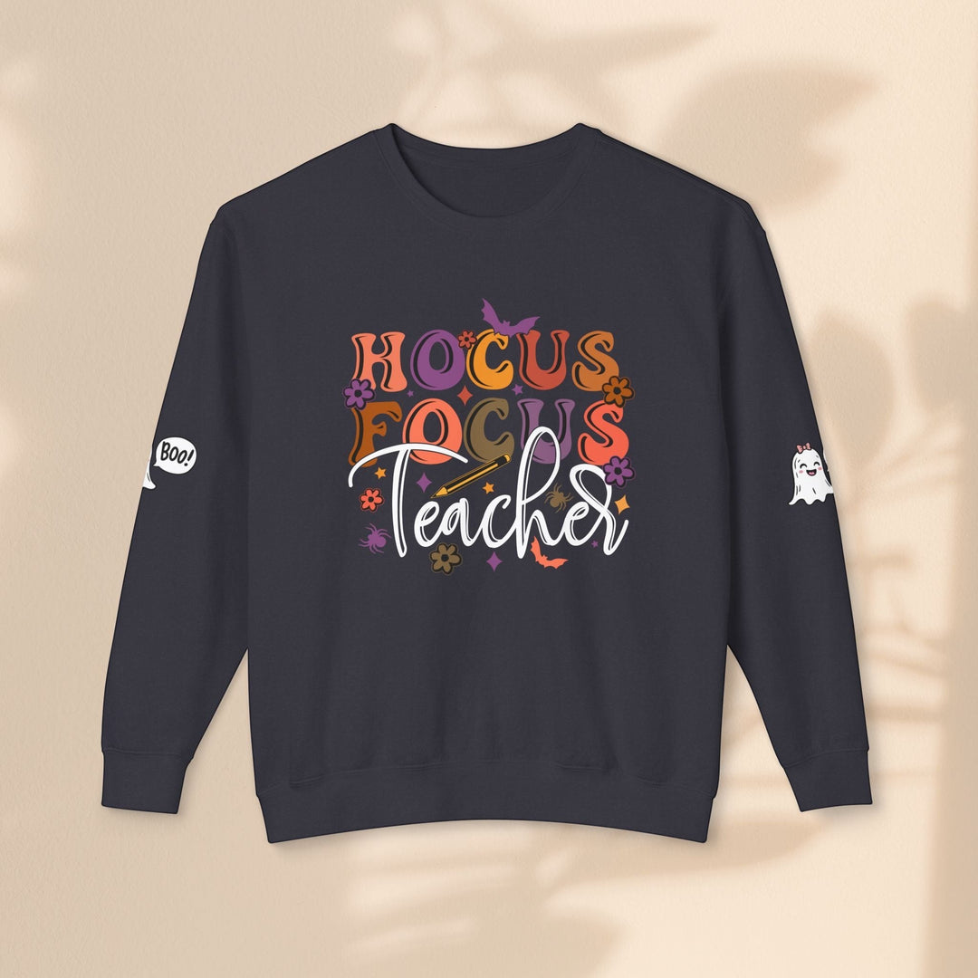 Sea Dragon Dreams dark grey unisex crewneck sweatshirt with Hocus Focus Teacher Halloween graphic and sleeve details.