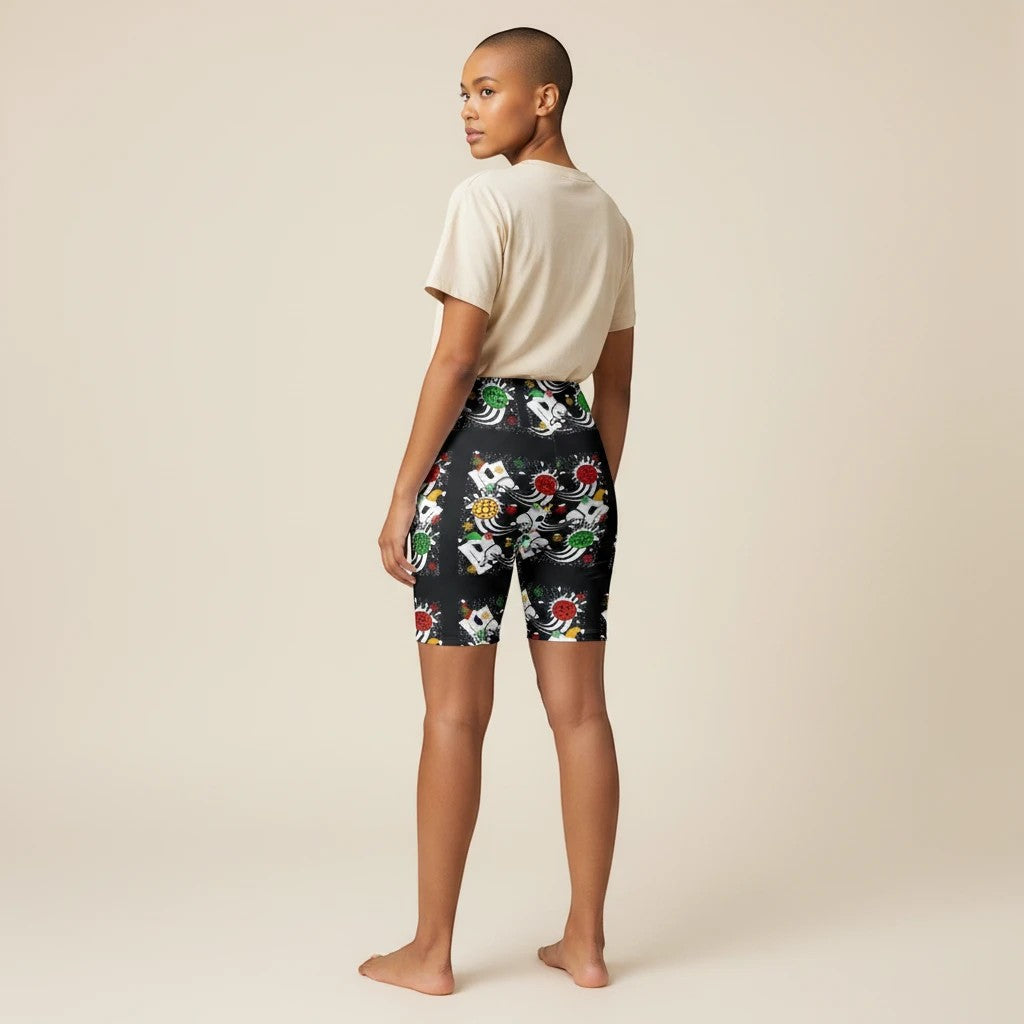 Sea Dragon Dreams women's workout shorts with a festive holiday pickleball print on black moisture-wicking fabric.