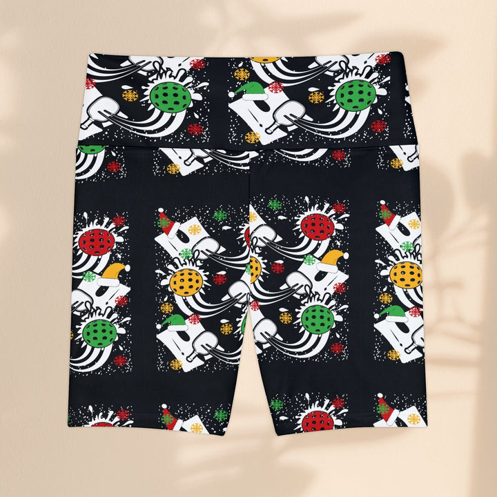 Sea Dragon Dreams women's workout shorts with a festive holiday pickleball print on black moisture-wicking polyester.