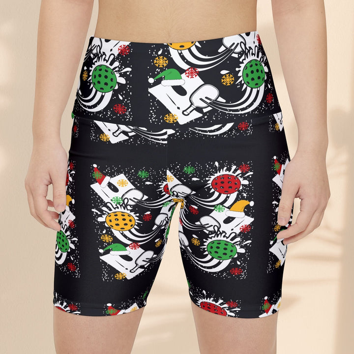 Sea Dragon Dreams women's black workout shorts featuring a festive holiday pickleball print with Santa hats and snow.