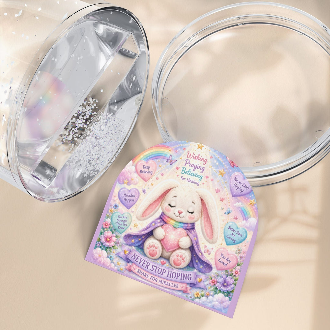Sea Dragon Dreams Brave Buddies Hope Bunny snow globe featuring a cute rabbit with inspirational messages and glitter.