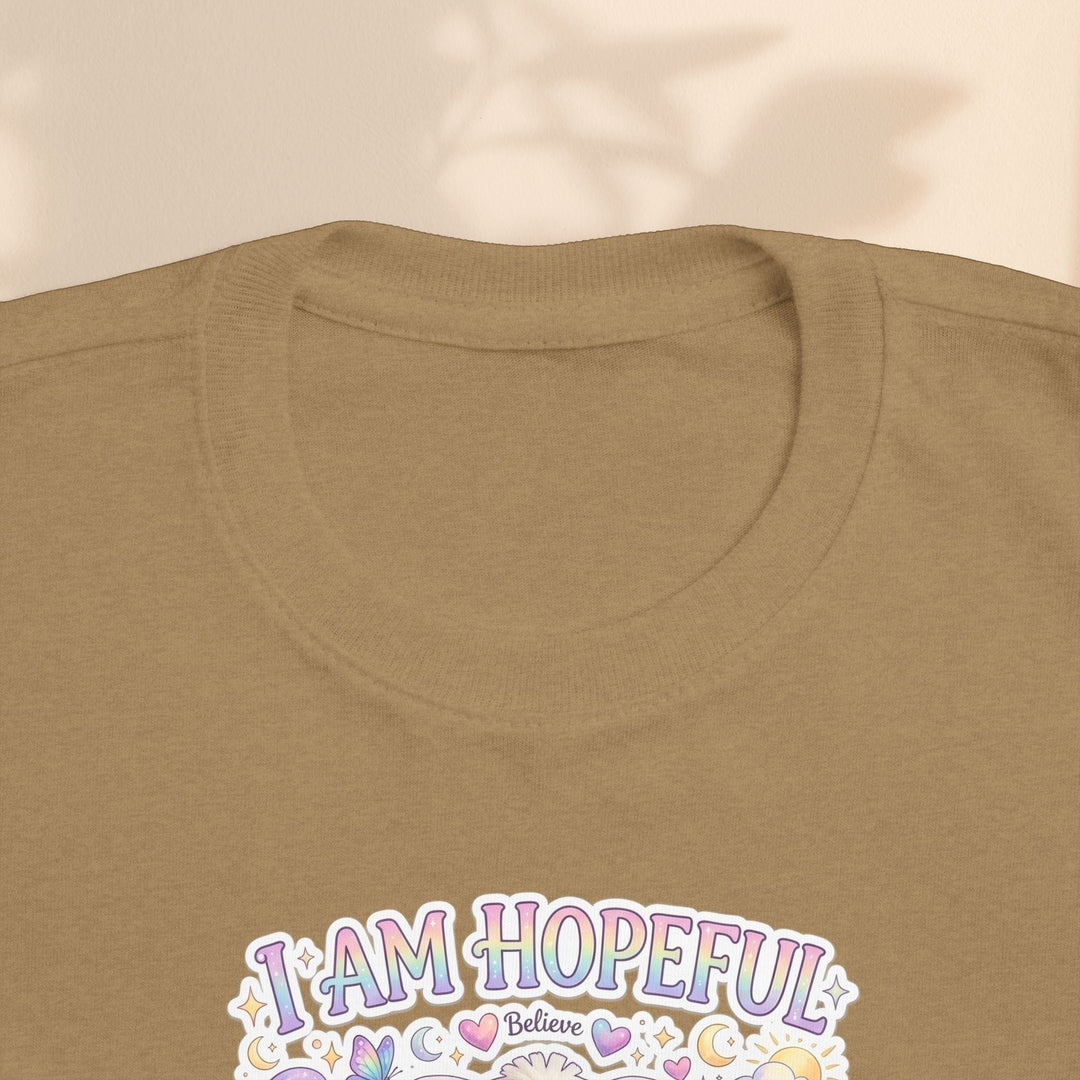 Sea Dragon Dreams Brave Buddies Hope Bunny toddler tee in tan cotton with I Am Hopeful graphic print.