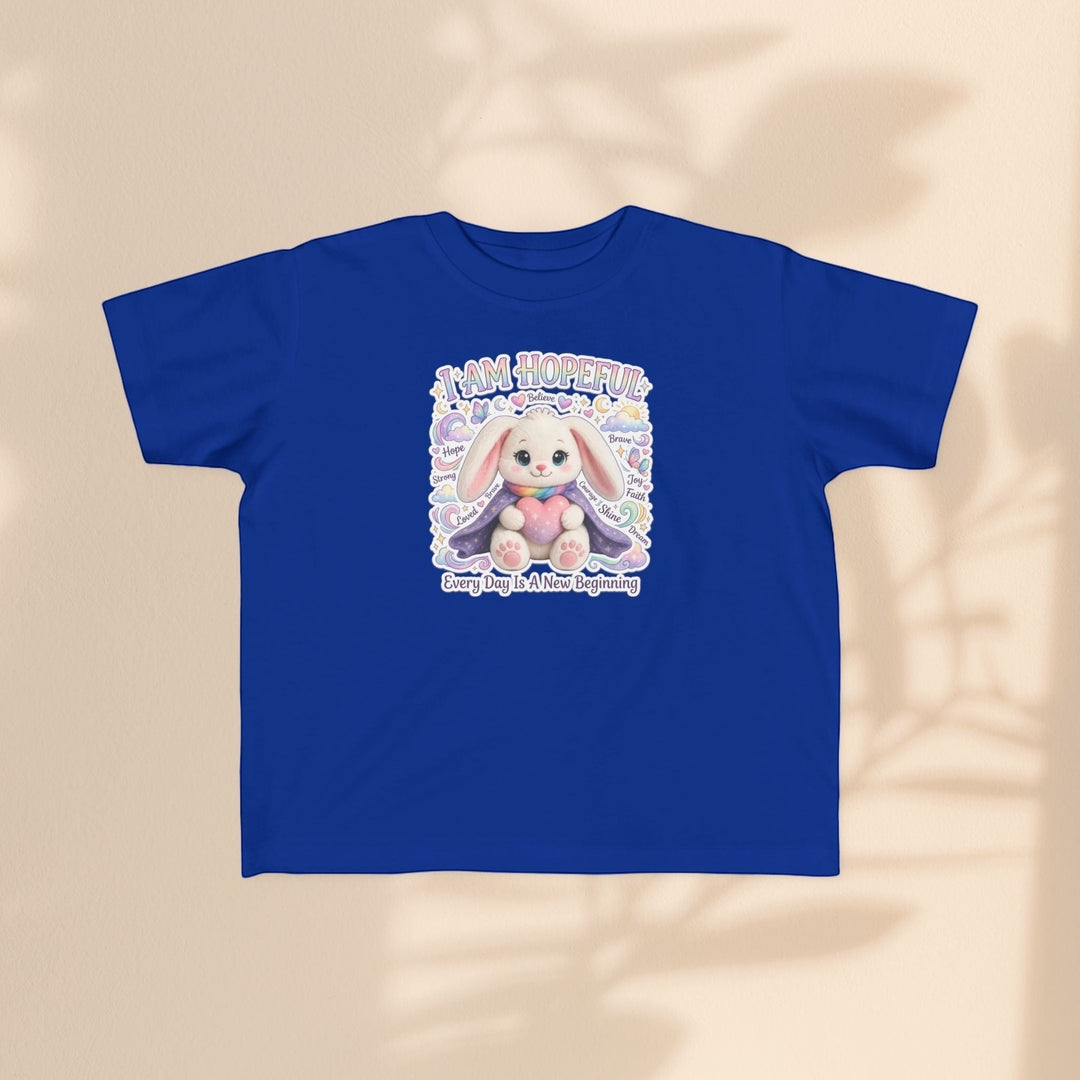 Sea Dragon Dreams toddler tee in blue cotton featuring a cute Hope Bunny graphic with the text I Am Hopeful.