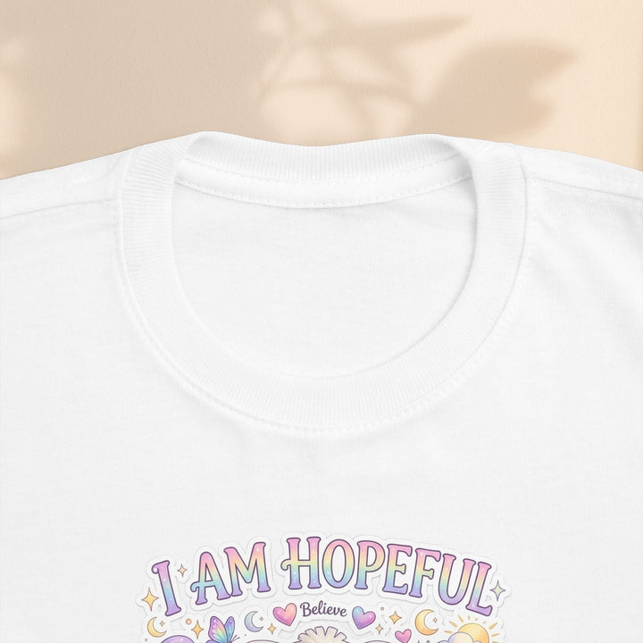 Sea Dragon Dreams toddler tee featuring Hope Bunny graphic with I Am Hopeful text in pastel colors on white cotton