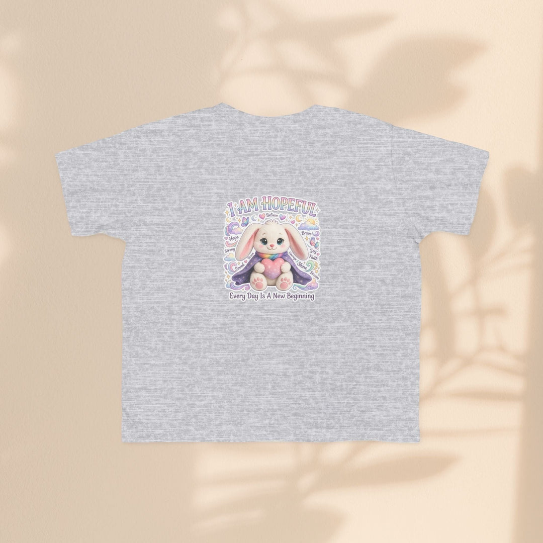 Sea Dragon Dreams toddler tee in heather grey cotton featuring a Hope Bunny graphic with the text I Am Hopeful.