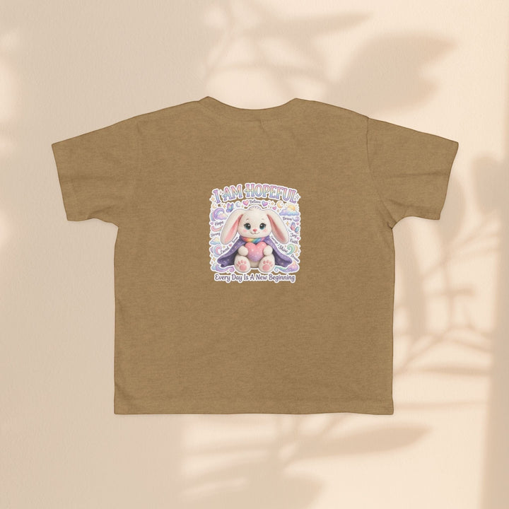 Sea Dragon Dreams toddler tee in tan cotton featuring the Brave Buddies Hope Bunny graphic with I Am Hopeful text.