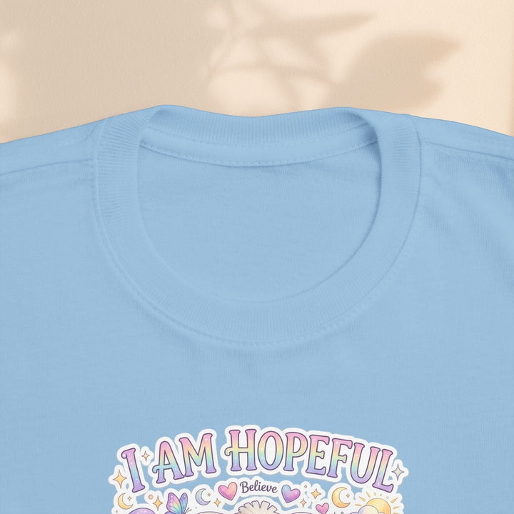 Sea Dragon Dreams light blue toddler t-shirt featuring the Hope Bunny I Am Hopeful graphic with pastel accents