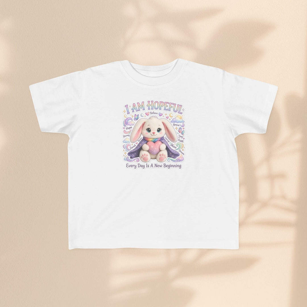 Sea Dragon Dreams toddler tee featuring a cute Hope Bunny illustration with the text I Am Hopeful on white cotton.
