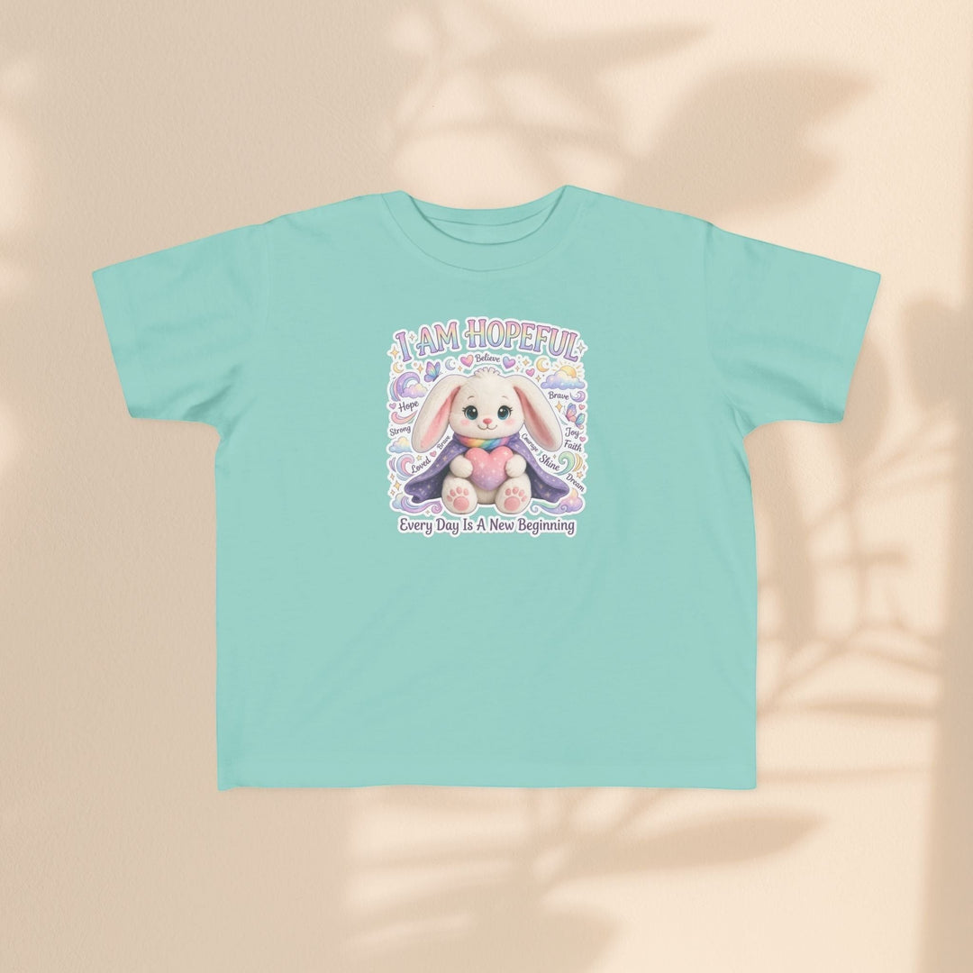 Sea Dragon Dreams toddler tee in light teal cotton featuring a cute Hope Bunny graphic and I Am Hopeful text.