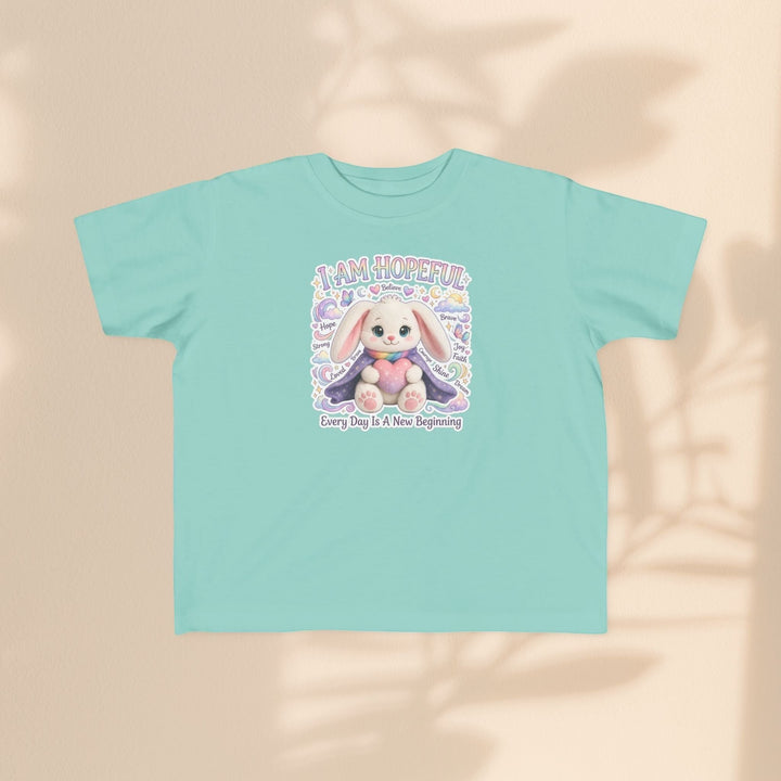 Sea Dragon Dreams toddler tee in light teal cotton featuring a cute Hope Bunny graphic and I Am Hopeful text.