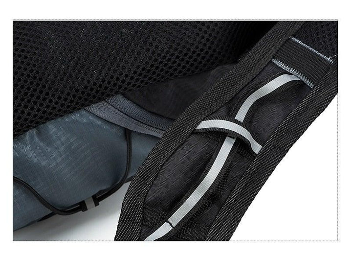Sea Dragon Dreams 10L hydration backpack strap detail showing reflective safety strips and breathable mesh padding