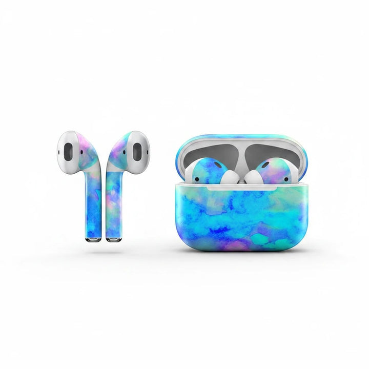 Sea Dragon Dreams ice blue vinyl skin on Apple AirPods and charging case with a vibrant marbled pattern