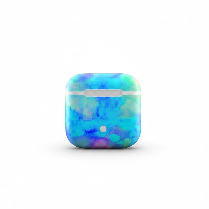 Sea Dragon Dreams Electrify Ice Blue vinyl skin on an Apple AirPods charging case with a vibrant watercolor design.