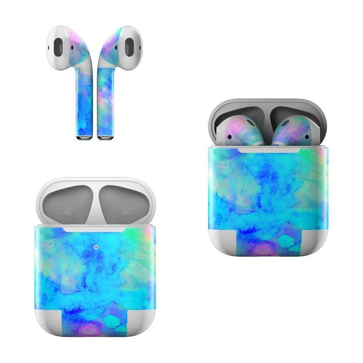 Sea Dragon Dreams ice blue vinyl skin on Apple AirPods and charging case with a vibrant watercolor pattern.