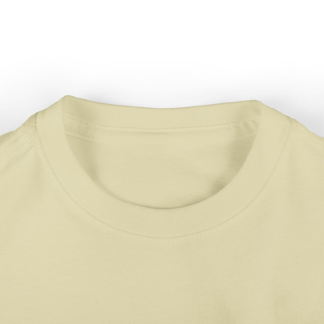 Sea Dragon Dreams infant fine jersey tee in a soft cream color with a ribbed crew neckline.