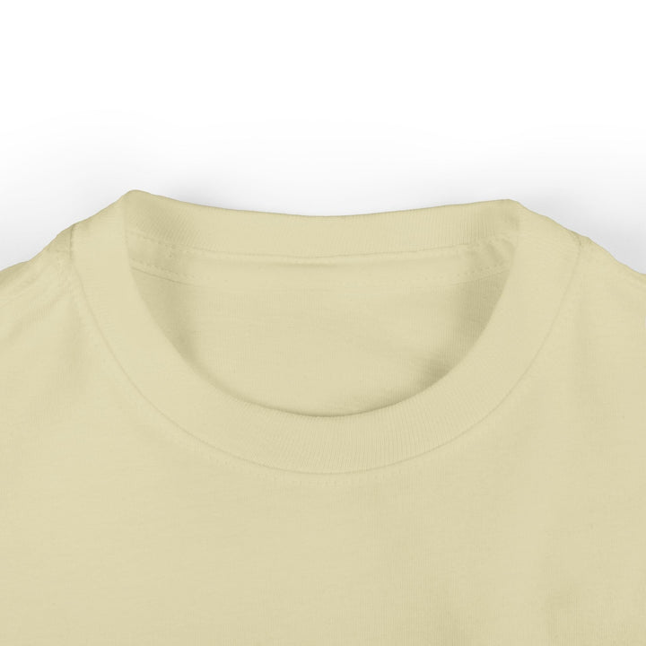 Sea Dragon Dreams infant fine jersey tee in a soft cream color with a ribbed crew neckline.