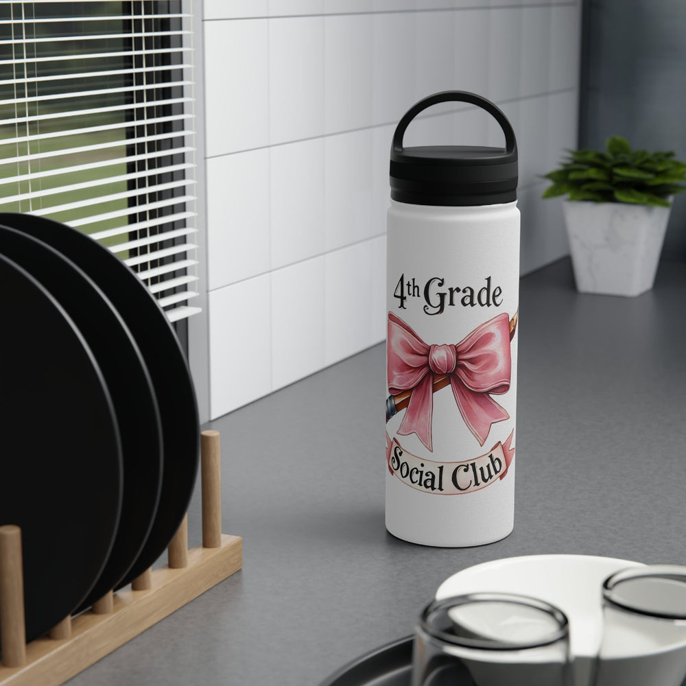 Sea Dragon Dreams insulated water bottle with 4th Grade Social Club text and pink bow design on a kitchen counter.