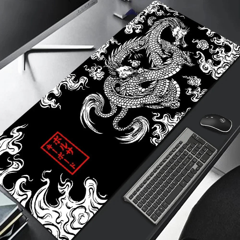 Sea Dragon Dreams XXL gaming mouse pad with black and white Japanese dragon art on a desk with keyboard and mouse