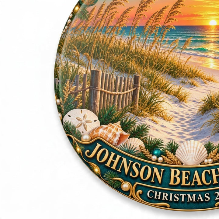 Sea Dragon Dreams ceramic Christmas ornament featuring a Johnson Beach sunset, seashells, and holiday greenery.