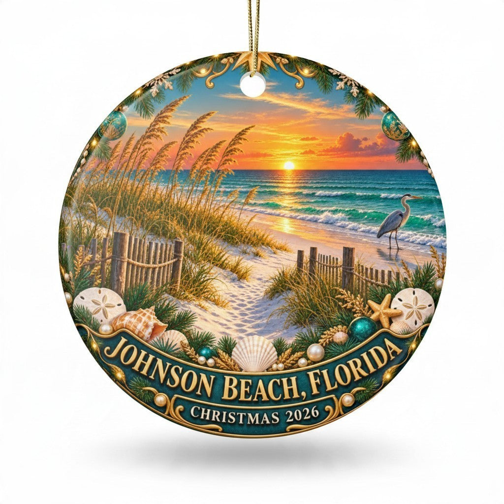 Sea Dragon Dreams ceramic Christmas ornament featuring a Johnson Beach sunset, heron, and shells, dated 2026.