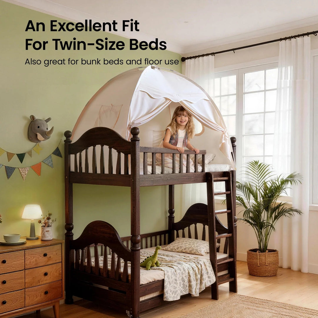 Sea Dragon Dreams kids bed tent in boho cream on a twin bunk bed with a young girl playing inside