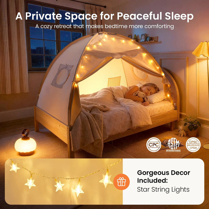 Sea Dragon Dreams kids bed tent in boho cream with star string lights, creating a cozy sleeping nook for a child.