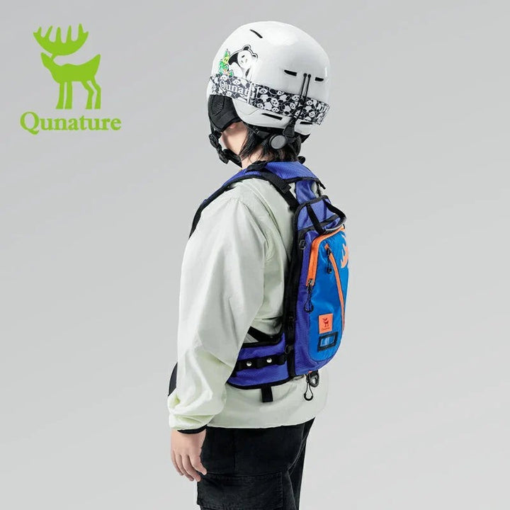 Sea Dragon Dreams Qunature H53 kids ski training backpack in blue with orange accents worn by a child with a helmet