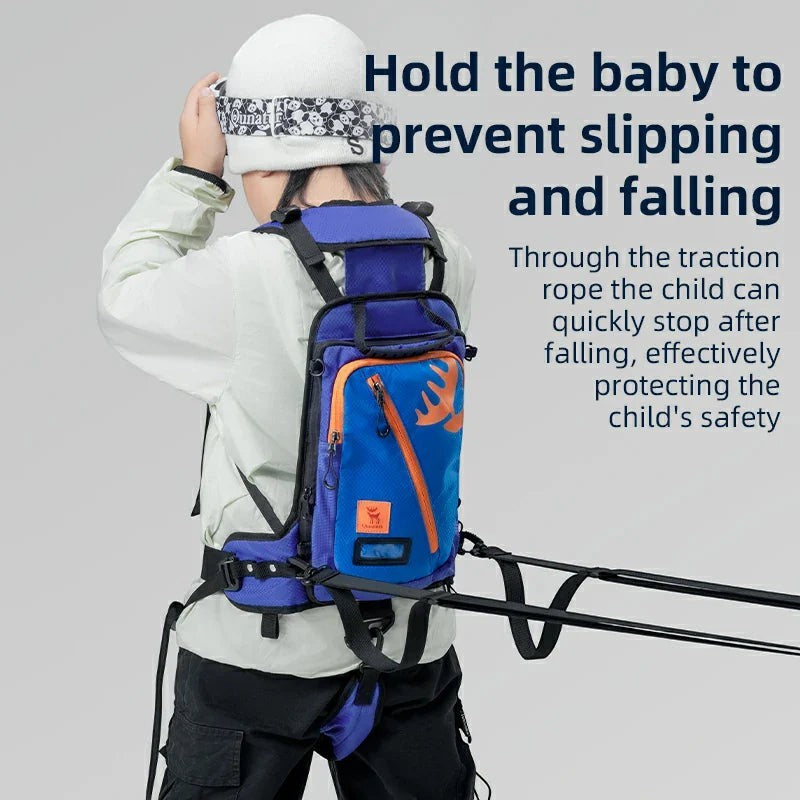 Sea Dragon Dreams Qunature H53 blue kids ski training backpack with traction rope worn by a child on the slopes