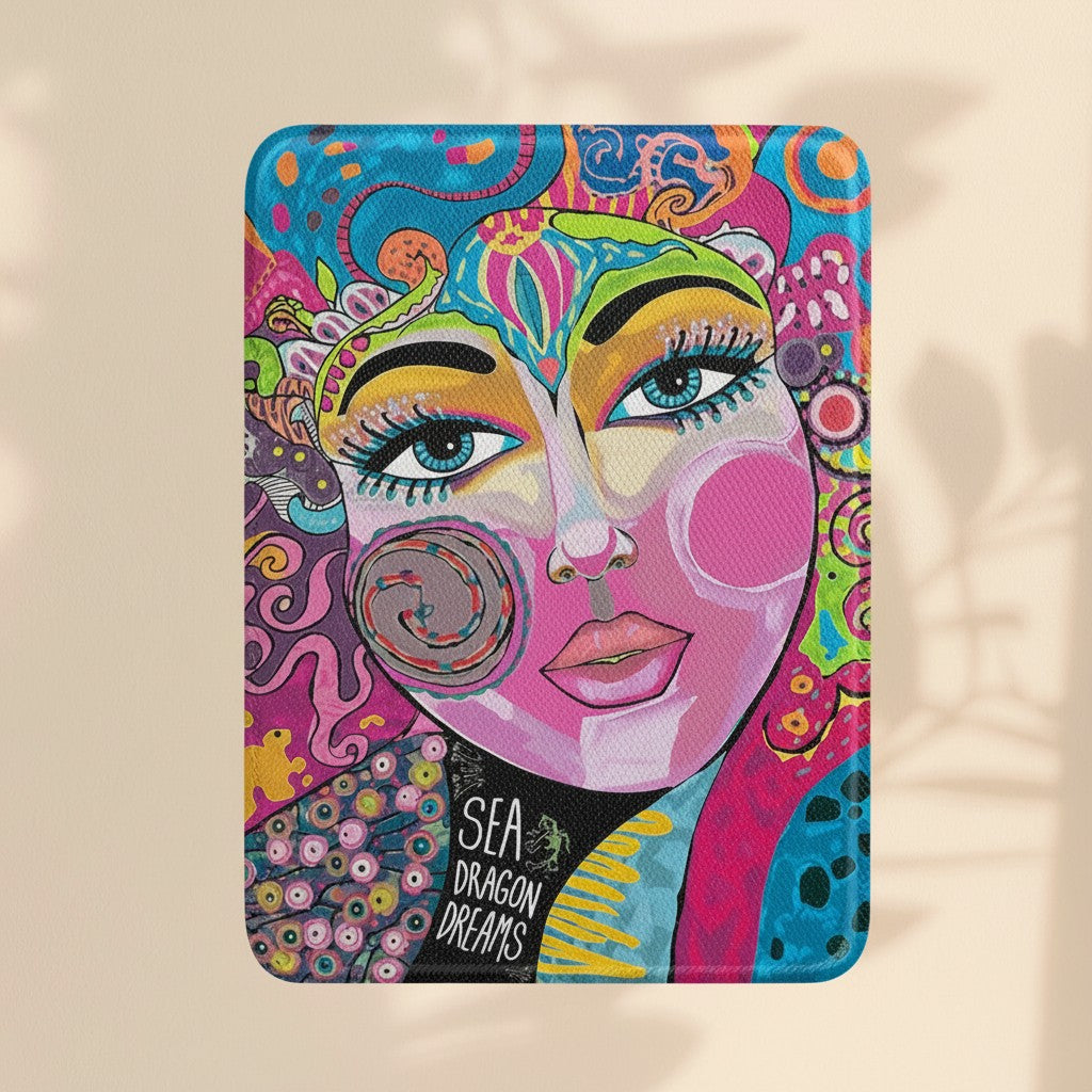 Sea Dragon Dreams Kindle Paperwhite case featuring vibrant bohemian art with a stylized face and colorful patterns.