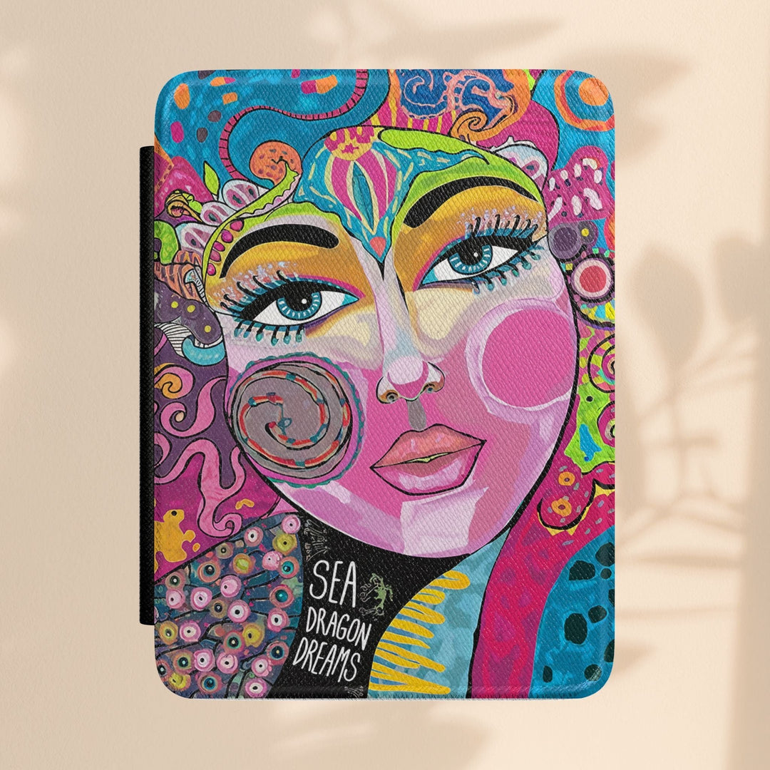 Sea Dragon Dreams Kindle Paperwhite case featuring vibrant bohemian art with a stylized face and colorful patterns.