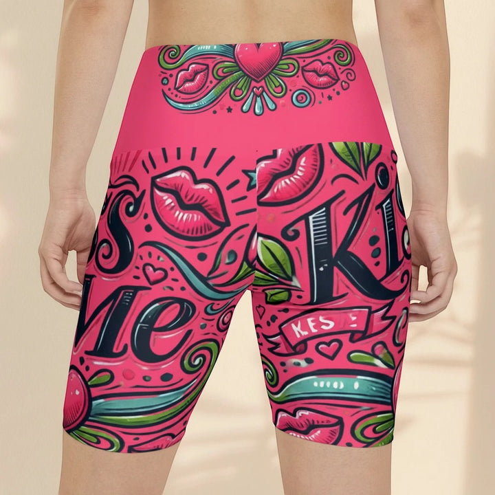 Sea Dragon Dreams high-waisted workout shorts in pink with a playful Kiss Me lip and heart graphic print