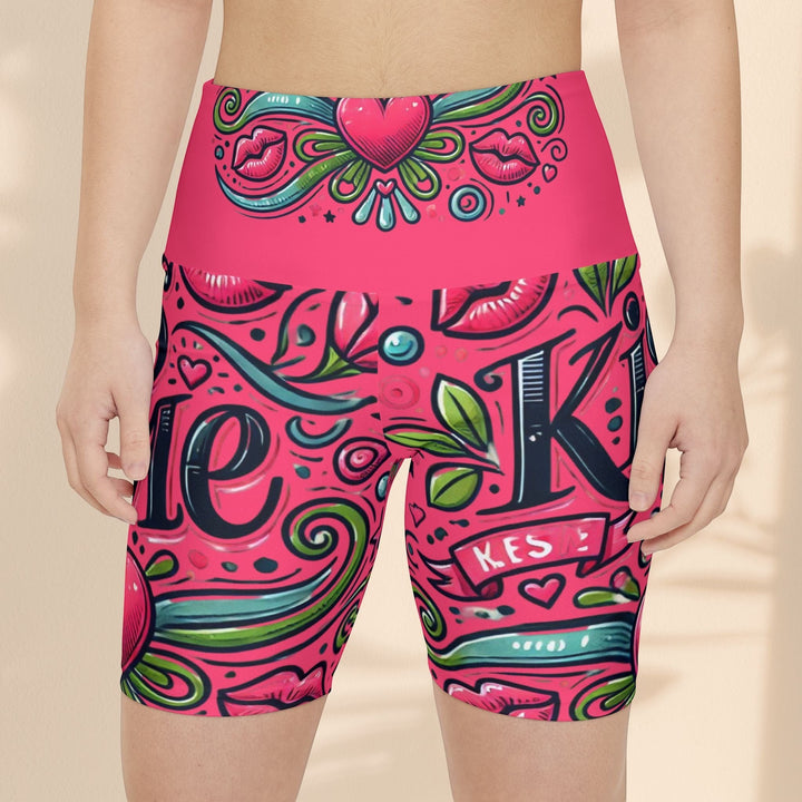 Sea Dragon Dreams high-waisted workout shorts in pink with a playful Kiss Me lip and heart pattern in polyester