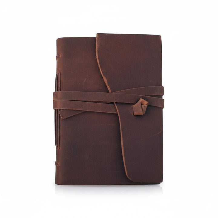 Sea Dragon Dreams Kodiak leather travel journal with a rustic brown wrap-around tie closure and handmade paper.