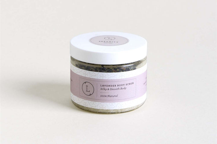 Sea Dragon Dreams lavender body scrub in a clear jar with a white lid and a soft purple label on a neutral background.
