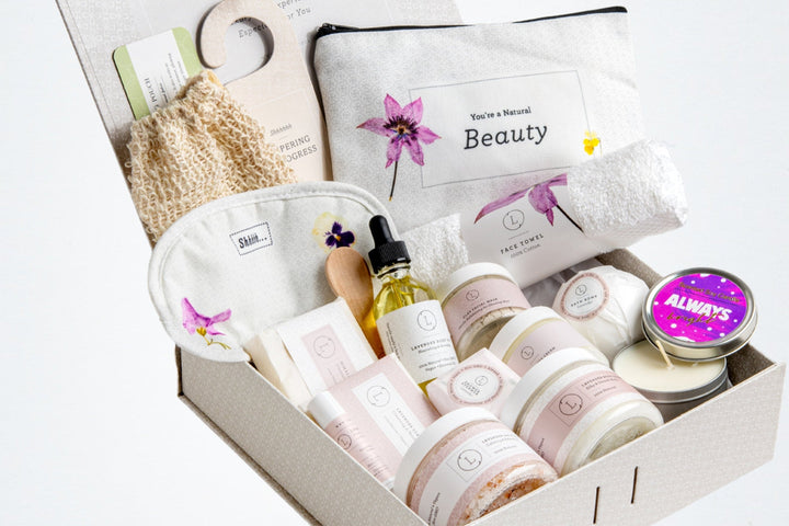 Sea Dragon Dreams lavender spa gift basket featuring all-natural bath and body products, eye mask, and cosmetic bag.