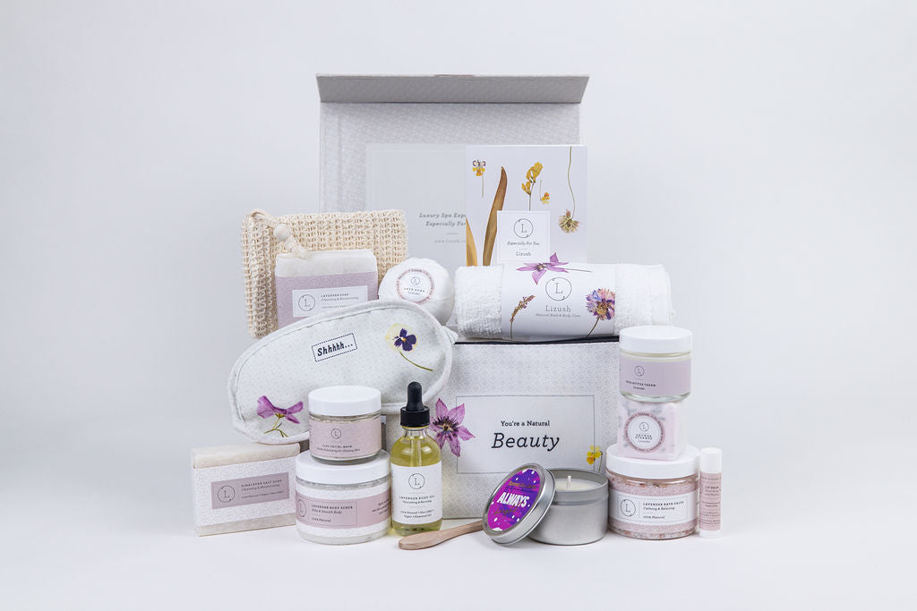 Sea Dragon Dreams lavender spa gift set featuring natural soaps, bath salts, body oil, candle, and eye mask in a box.