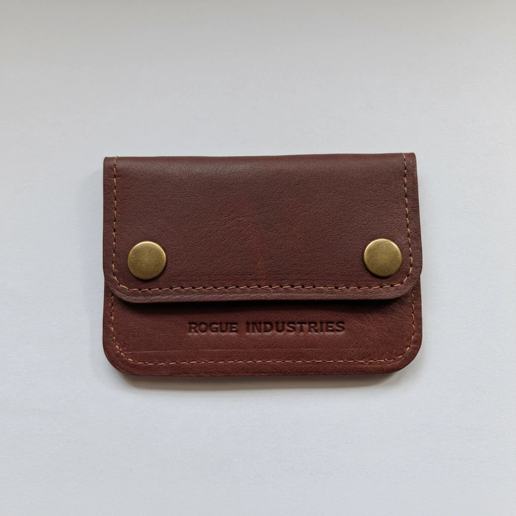 Sea Dragon Dreams Rogue full-grain leather belt wallet in brown with brass snap closures and minimalist design.