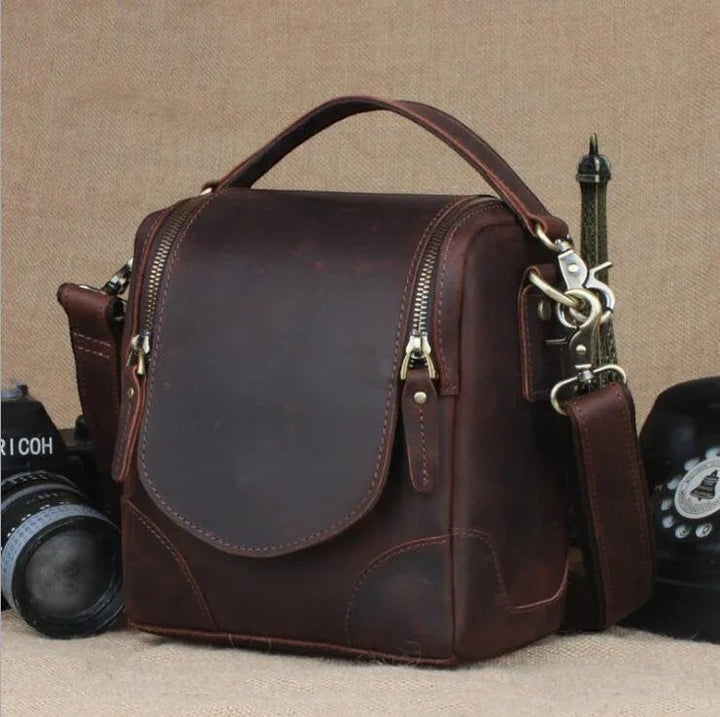 Sea Dragon Dreams The Calista handcrafted dark brown full-grain leather camera bag with a vintage design and top handle.