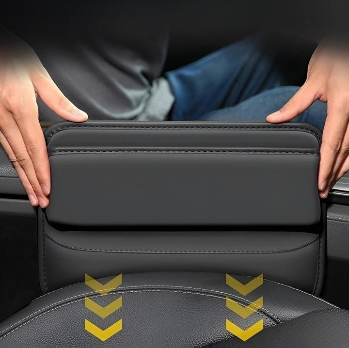 Sea Dragon Dreams black PU leather car seat gap organizer being installed between a vehicle seat and console.