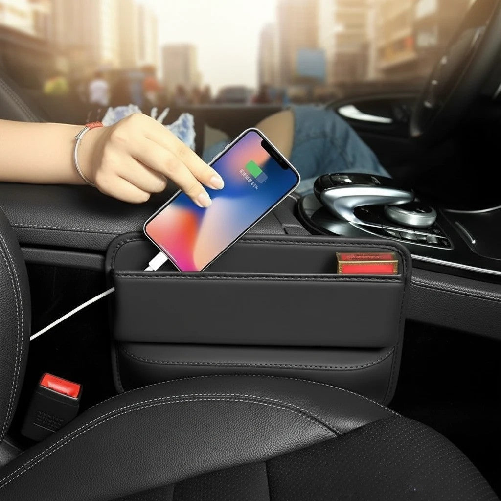 Sea Dragon Dreams black PU leather car seat gap organizer holding a smartphone and charging cable in a vehicle