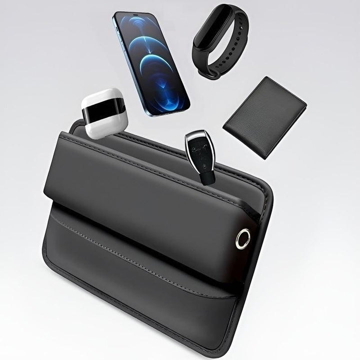 Sea Dragon Dreams black PU leather car seat gap organizer holding a smartphone, wallet, and accessories.