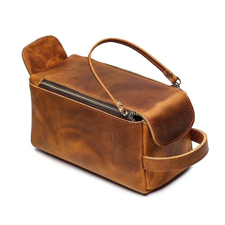 Sea Dragon Dreams handmade brown leather toiletry bag with zipper closure and side carry handle for travel