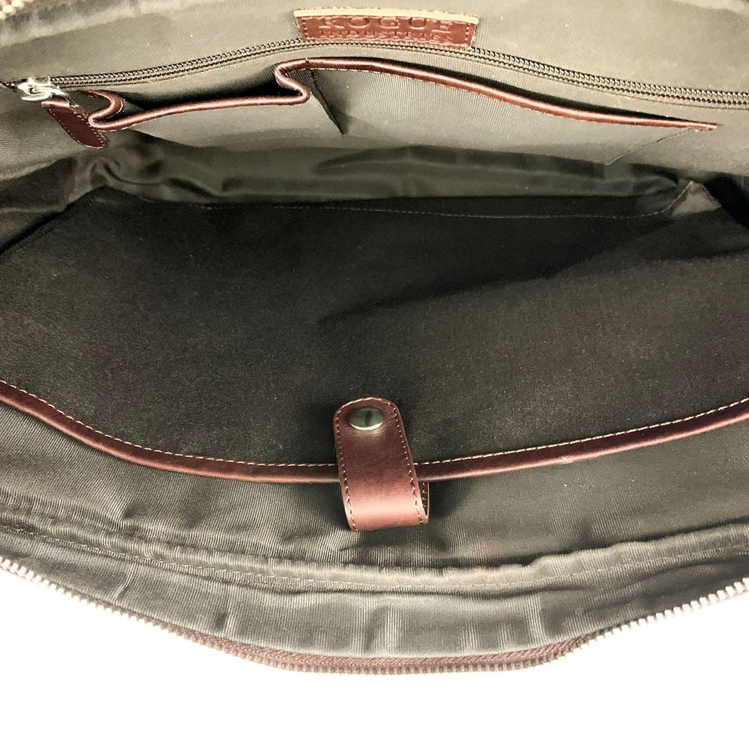 Interior of Sea Dragon Dreams West End slim leather laptop bag showing cotton lining, laptop sleeve, and pockets.