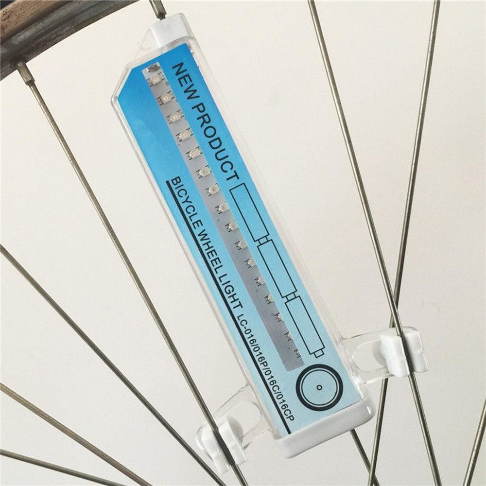 Sea Dragon Dreams RGB LED bike wheel light mounted on bicycle spokes, featuring a white casing and visible LEDs.
