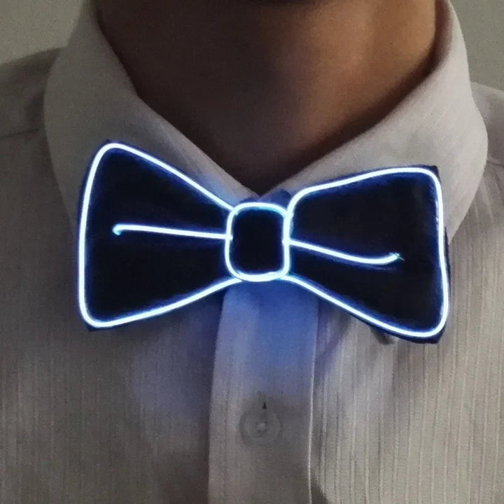 Sea Dragon Dreams light-up LED bow tie with glowing white neon trim worn on a white dress shirt for parties.