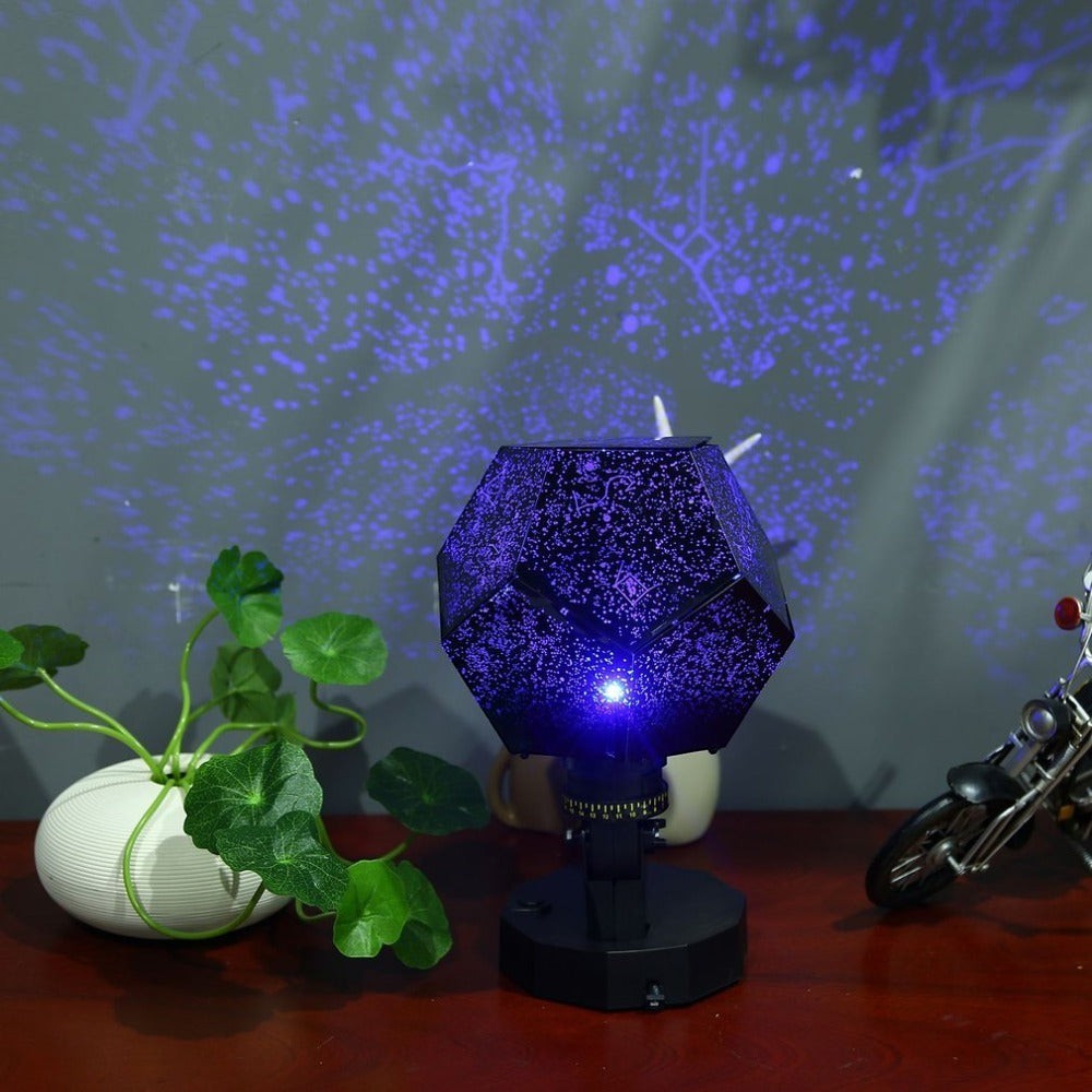 Sea Dragon Dreams LED star projector lamp casting blue constellation patterns on a wall in a dark room