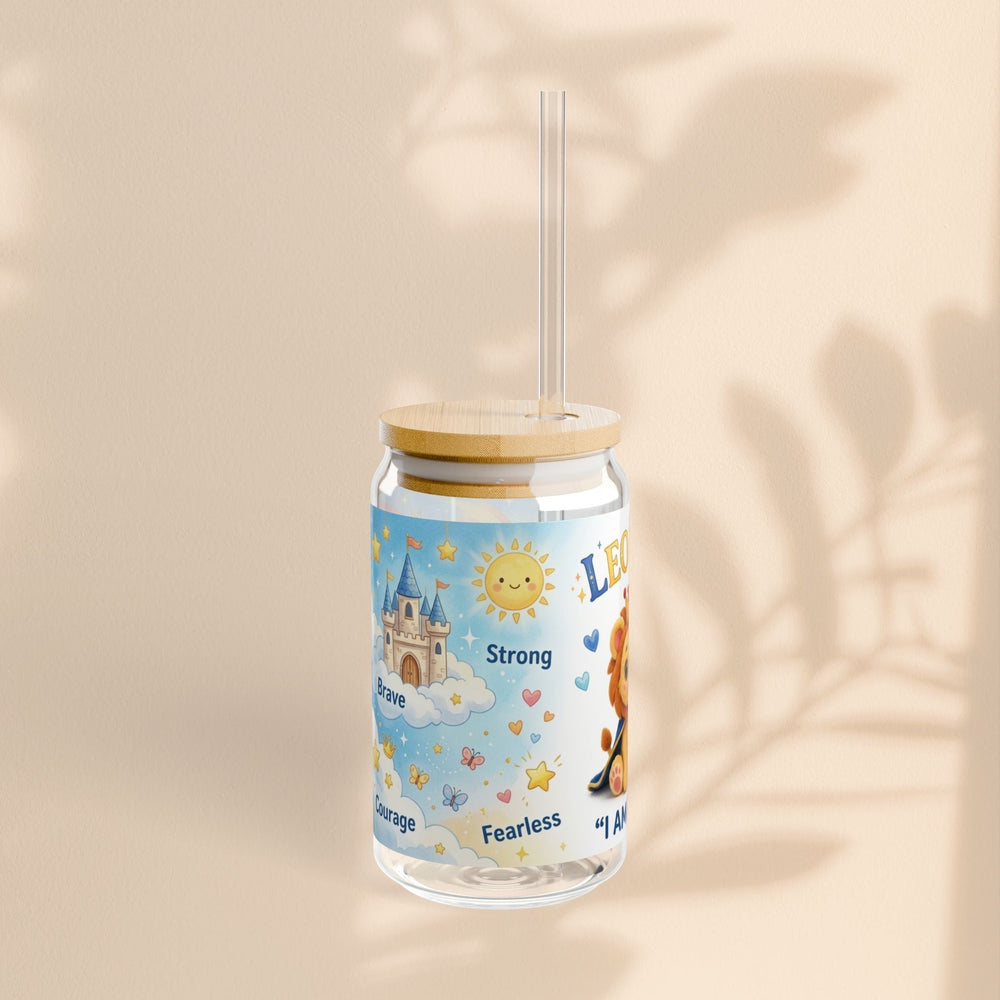 Sea Dragon Dreams 16 oz glass sipper featuring Leo Lion, a castle, and I Am Brave text with bamboo lid and clear straw.