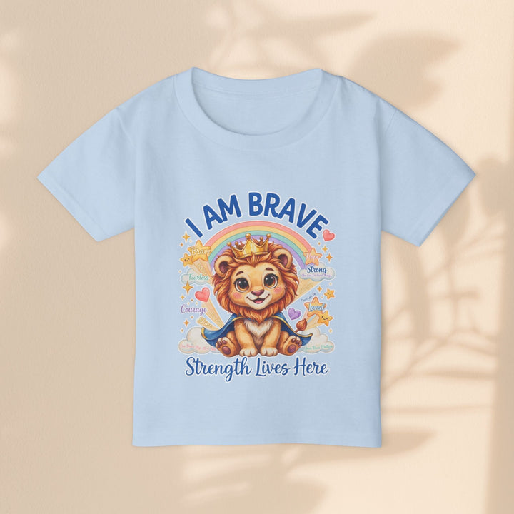 Sea Dragon Dreams toddler t-shirt in light blue cotton featuring a cute Leo Lion graphic with I Am Brave text.